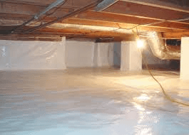 A crawlspace that has been flooded with water.