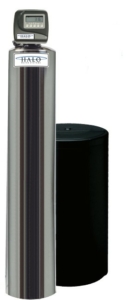 A tall, stainless steel water softener unit next to a large, cylindrical black tank.
