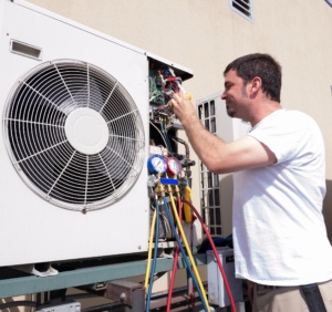 Worker repairing HVAC unit