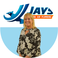 Professional woman standing in front of a company logo for Jay's Heating, Air, & Plumbing, ready to meet the team.