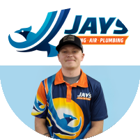 Meet the team! A person in a Jays Heating, Air, and Plumbing uniform stands proudly in front of a logo with matching branding.